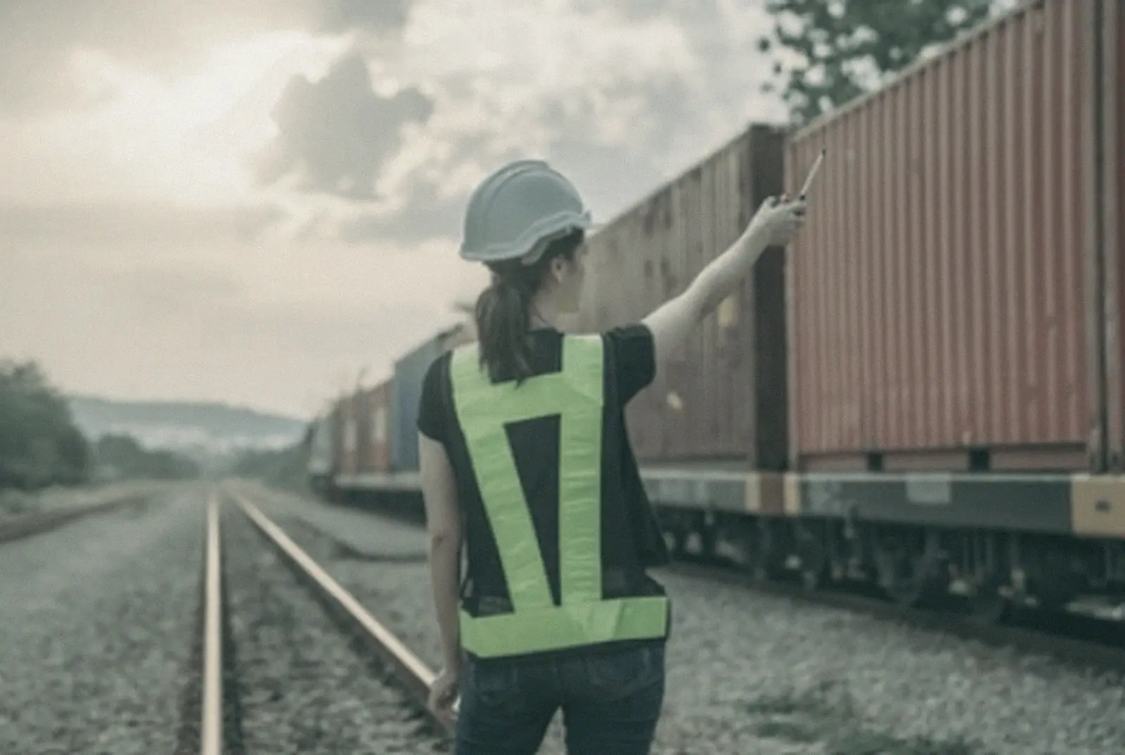 Rail operator checking a container train